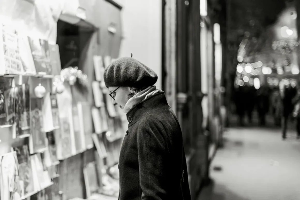 woman looking onto a magazine rack