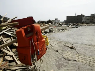 A view of debris and mud covering the tsunami-devastated city of Rikuzentakata, Japan, on March 20, 2011. On March 11, 2011, a magnitude 9.0 earthquake—the strongest in Japan’s recorded history and among the five most powerful ever worldwide—struck the region. Within an hour, coastal towns were flattened by a massive tsunami triggered by the quake. Waves up to four or five meters high swept through homes, towns, and fields, leaving widespread destruction in their wake.