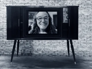 image of Kevin Kolbe in a television screen