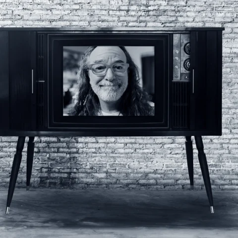 image of Kevin Kolbe in a television screen